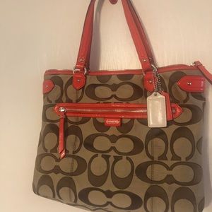 Orange Trim, tan coach tote purse.